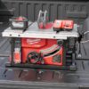 Milwaukee M18 FUEL cordless table saw with battery, charger, and compact portable design