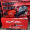 Milwaukee M18 FUEL 9 inch cordless cut-off saw with ONE-KEY technology and cutting blade displayed in retail packaging.